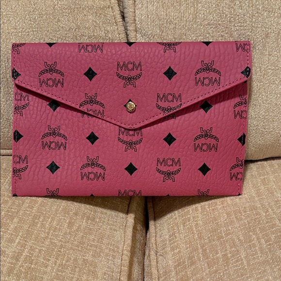 MCM Handbags - MCM Fuchsia Clutch with Black Accents